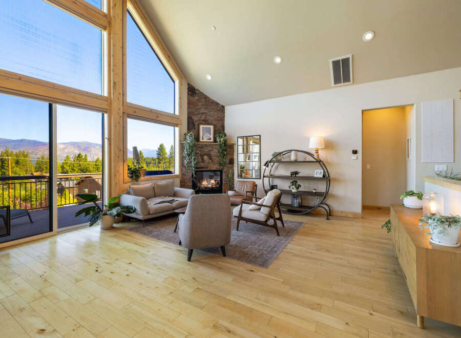 Experience luxury living in this stunning property, featuring expansive windows that frame breathtaking mountain views.