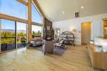 Experience luxury living in this stunning property, featuring expansive windows that frame breathtaking mountain views.
