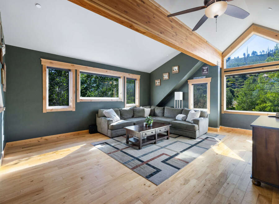 Discover the charm of this stunning living room, featuring a cozy sectional sofa and a stylish coffee table, perfect for relaxation and entertaining.