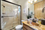Step into luxury with this stunning bathroom! Featuring a beautiful copper sink, a spacious walk-in shower, and elegant tile work, this space is designed for both style and functionality.
