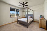 Step into this inviting bedroom, featuring a stylish four-poster bed and a serene ambiance.