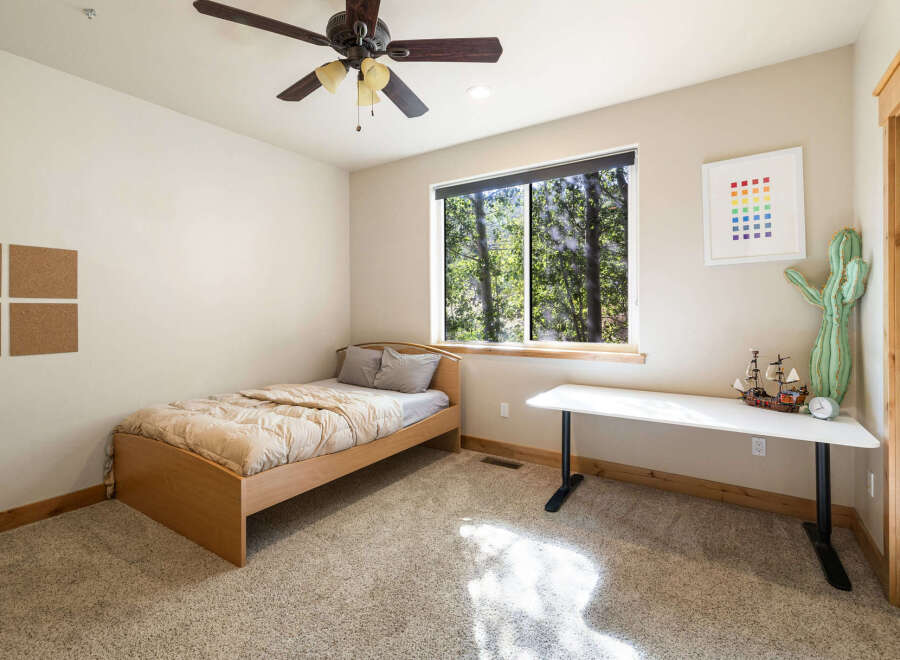 This cozy bedroom features a comfortable bed, perfect for a relaxing night's sleep.