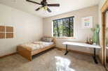 This cozy bedroom features a comfortable bed, perfect for a relaxing night's sleep.
