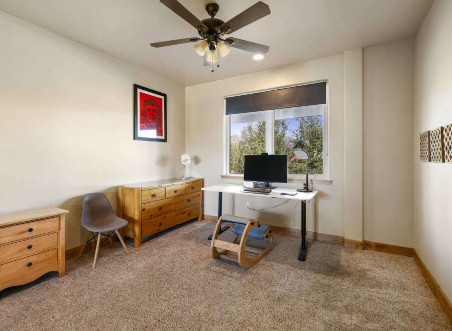 This inviting home office features a bright and airy atmosphere, perfect for productivity.