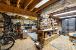 Discover the potential of this versatile space! This image showcases a well-organized workshop area, perfect for DIY projects or hobbies.