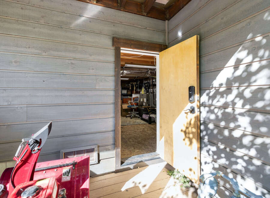 Step into this inviting space, perfect for a workshop or storage.