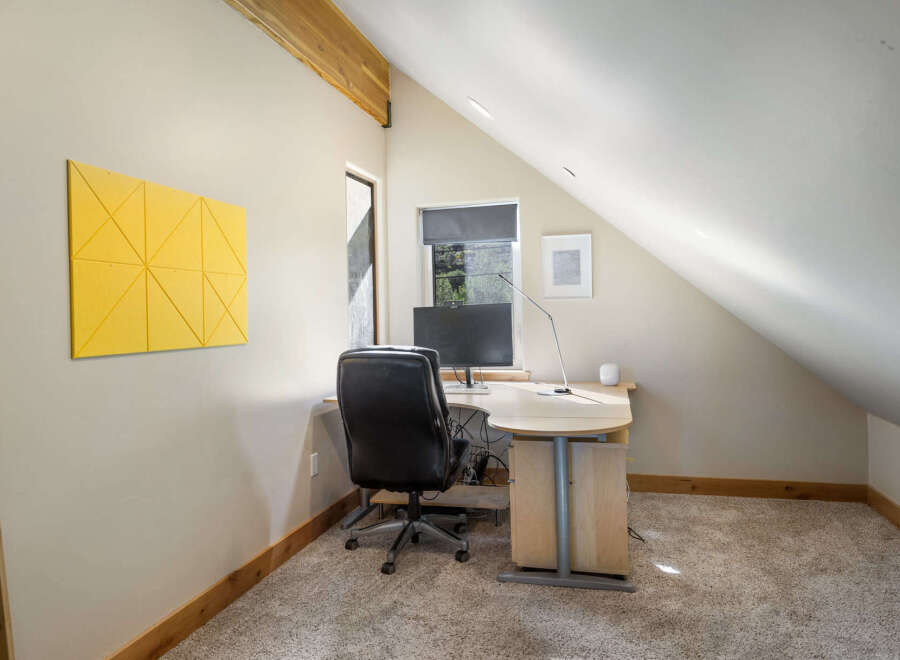 This charming home office space offers a bright and airy atmosphere, perfect for productivity.