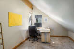 This charming home office space offers a bright and airy atmosphere, perfect for productivity.