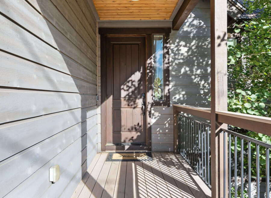 Welcome to your dream home! This stunning property features a beautiful wooden front door, inviting you into a space filled with warmth and charm.