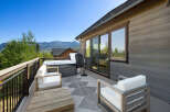 Enjoy breathtaking mountain views from this stunning property featuring a luxurious hot tub and a spacious deck.