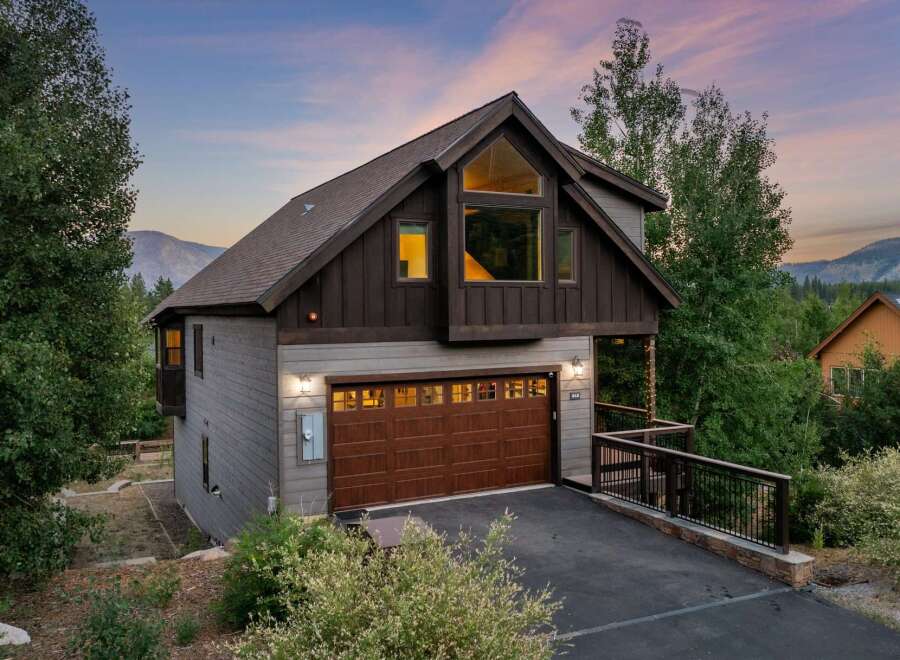 Discover the charm of this stunning mountain home, featuring a spacious garage and a beautifully designed exterior.