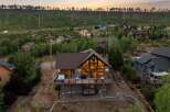 Escape to your dream mountain retreat! This stunning home boasts a spacious deck with a hot tub, perfect for relaxing and enjoying the breathtaking views.