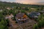Discover your dream mountain retreat! This stunning home boasts a spacious deck with a hot tub, perfect for enjoying breathtaking views.