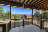 Enjoy breathtaking views from this stunning deck! This property features a spacious outdoor area, perfect for relaxation and entertaining.