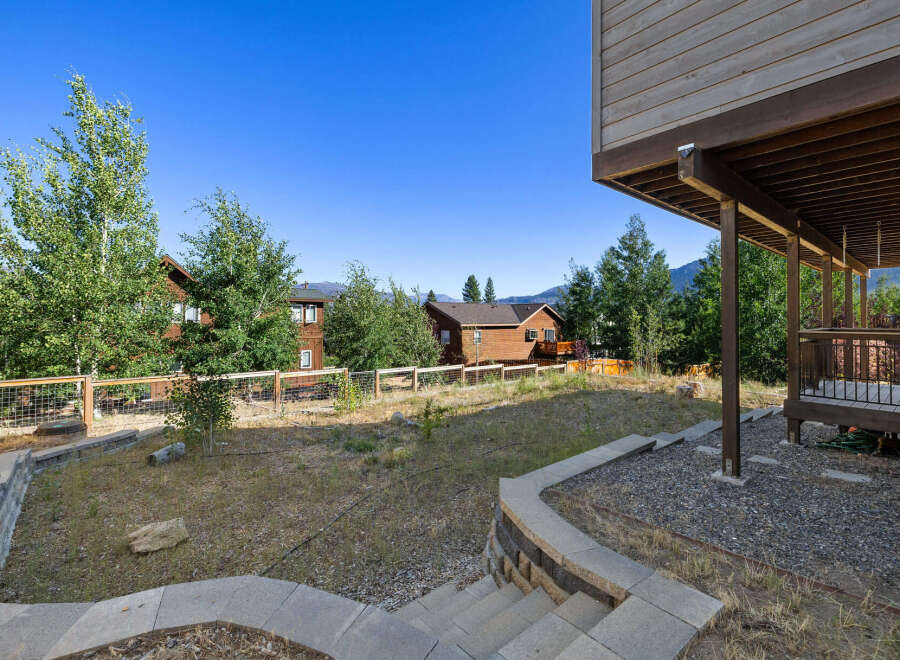 Discover the charm of this stunning property, showcasing a beautifully landscaped yard and a welcoming outdoor space.