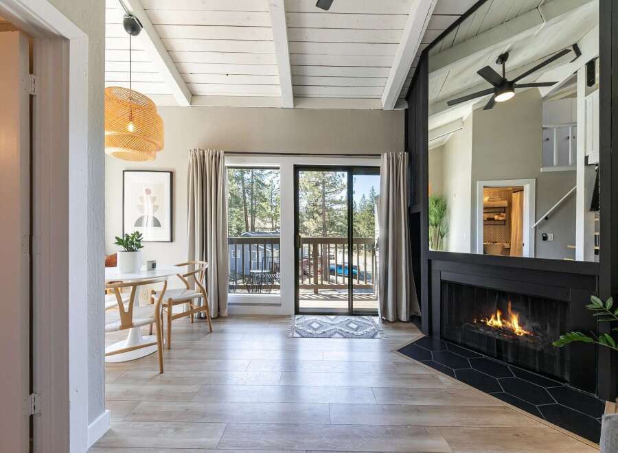 Step into this stunning property featuring a cozy fireplace and a bright, airy living space.
