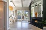 Step into this stunning property featuring a cozy fireplace and a bright, airy living space.