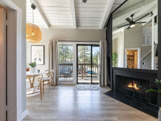 Step into this stunning property featuring a cozy fireplace and a bright, airy living space.