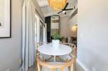 This stunning property features a bright and airy dining area, perfect for entertaining or enjoying a quiet meal.