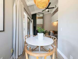 This stunning property features a bright and airy dining area, perfect for entertaining or enjoying a quiet meal.