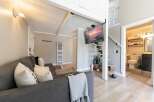 Discover this charming property featuring a cozy living area with a comfortable sofa and stylish decor.