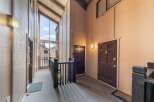 Step into a welcoming entryway with a unique architectural design.