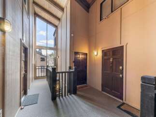 Step into a welcoming entryway with a unique architectural design.