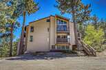 Discover your dream mountain retreat! This stunning property boasts a modern design with multiple levels, offering ample space and privacy.