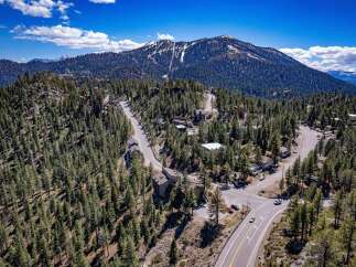 Discover your dream mountain retreat in this stunning property nestled amidst a lush forest.