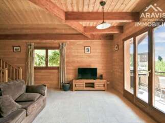 Discover the charm of this stunning property, featuring a warm and inviting interior with beautiful wooden walls and ceilings.