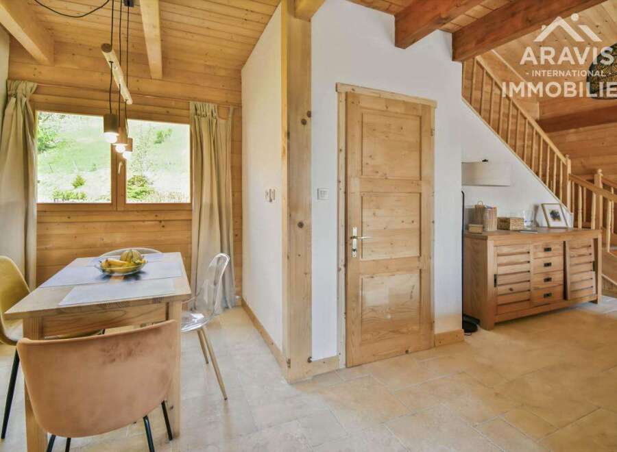Discover the charm of this stunning property, featuring a warm and inviting interior with wooden accents throughout.