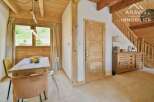 Discover the charm of this stunning property, featuring a warm and inviting interior with wooden accents throughout.