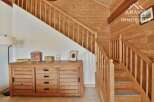 Discover the charm of this stunning property featuring a beautifully crafted wooden staircase and a warm, inviting interior.
