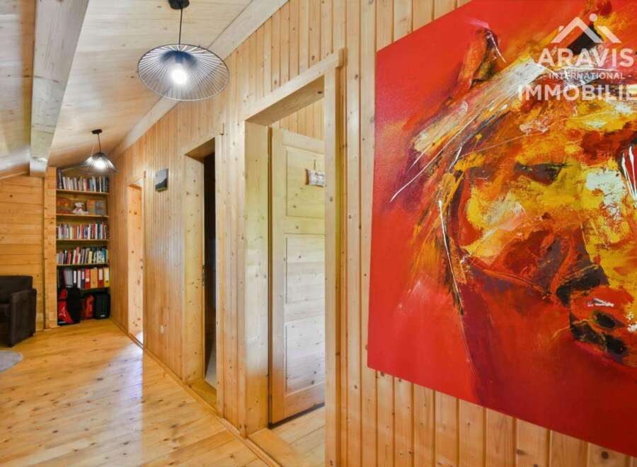 Discover this stunning property featuring a warm and inviting interior with wooden paneling throughout.