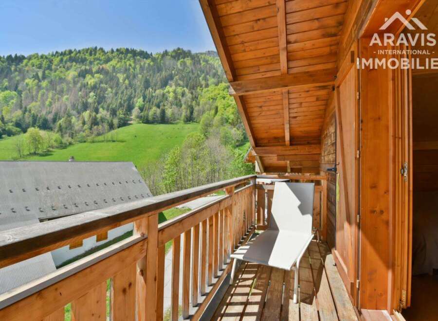 Enjoy breathtaking mountain views from this charming balcony.