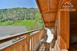Enjoy breathtaking mountain views from this charming balcony.