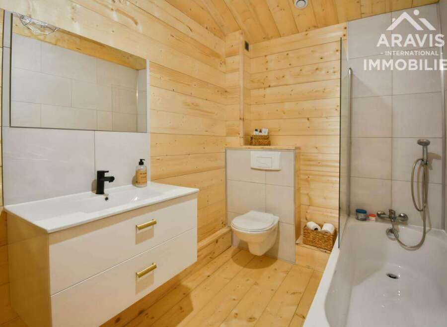 Discover the charm of this beautifully designed bathroom, featuring a modern vanity and a sleek, contemporary design.