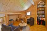 Discover the charm of this cozy attic space, perfect for a home office or relaxation area.