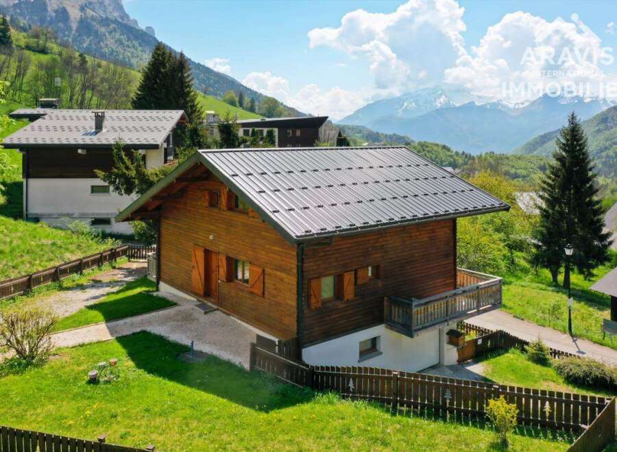 Discover a charming wooden chalet nestled in a picturesque mountain setting.