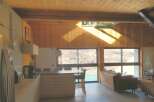 This stunning property boasts a modern kitchen with sleek countertops and ample storage, perfect for culinary enthusiasts.