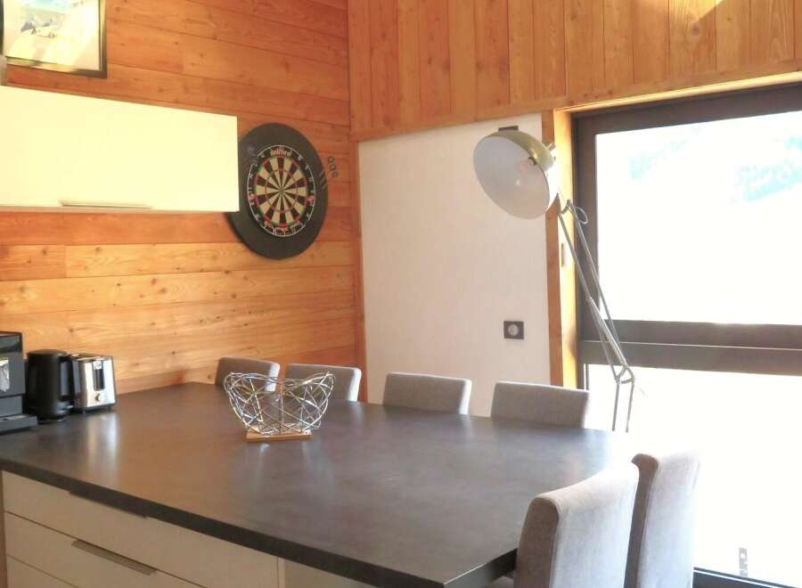 This stunning property boasts a modern dining area, perfect for entertaining guests.