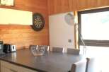 This stunning property boasts a modern dining area, perfect for entertaining guests.