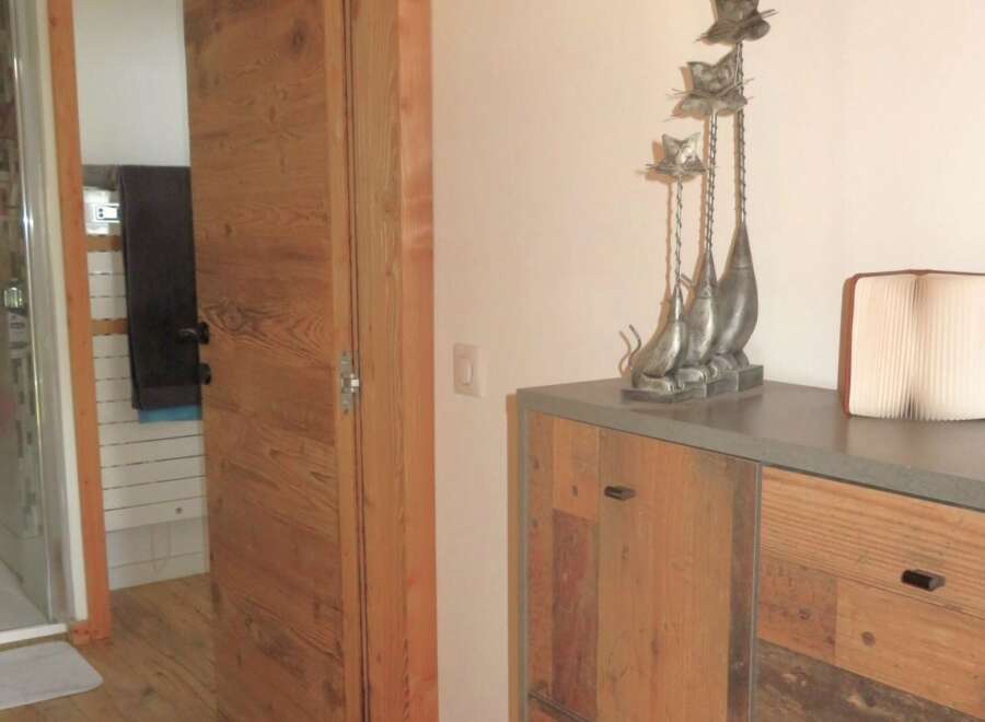 This stunning property boasts a beautifully designed interior with a focus on natural materials.
