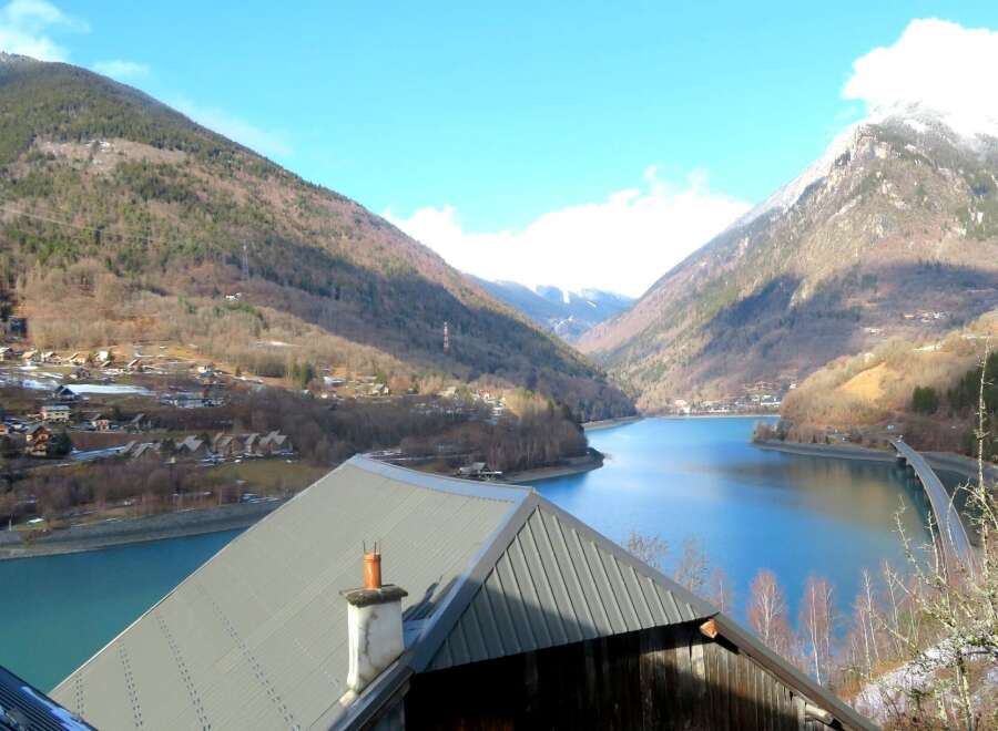 Discover breathtaking views from this stunning property! Nestled in a picturesque valley, this home offers unparalleled access to a serene lake and majestic mountains.