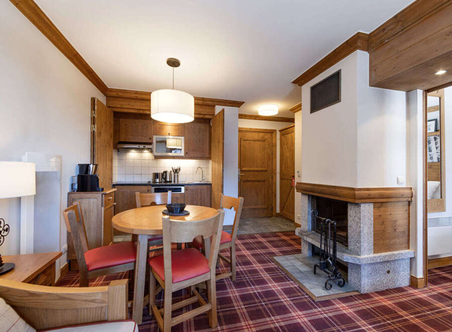 Discover the charm of this cozy property, featuring a well-equipped kitchen and a welcoming dining area perfect for gatherings.
