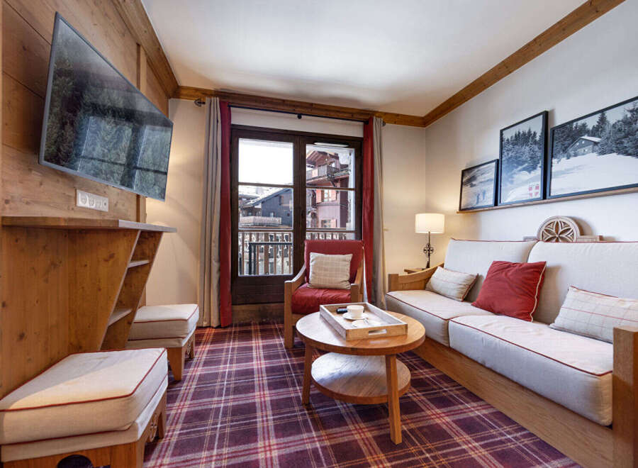 Step into this cozy living space, perfect for relaxing after a day on the slopes.