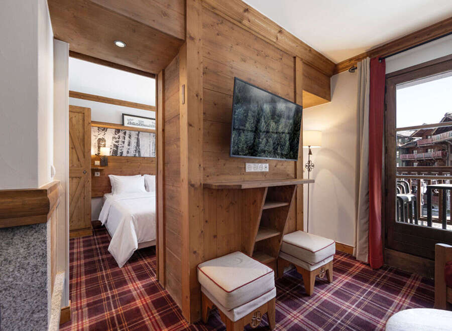 Experience the charm of this cozy mountain retreat, featuring rustic wooden accents and a warm, inviting atmosphere.