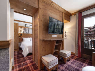 Experience the charm of this cozy mountain retreat, featuring rustic wooden accents and a warm, inviting atmosphere.