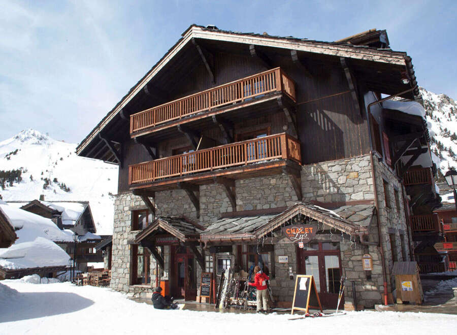 This stunning chalet-style property boasts a unique blend of rustic charm and modern amenities, perfect for a luxurious mountain getaway.