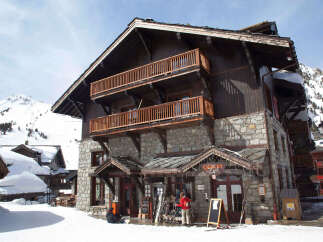This stunning chalet-style property boasts a unique blend of rustic charm and modern amenities, perfect for a luxurious mountain getaway.